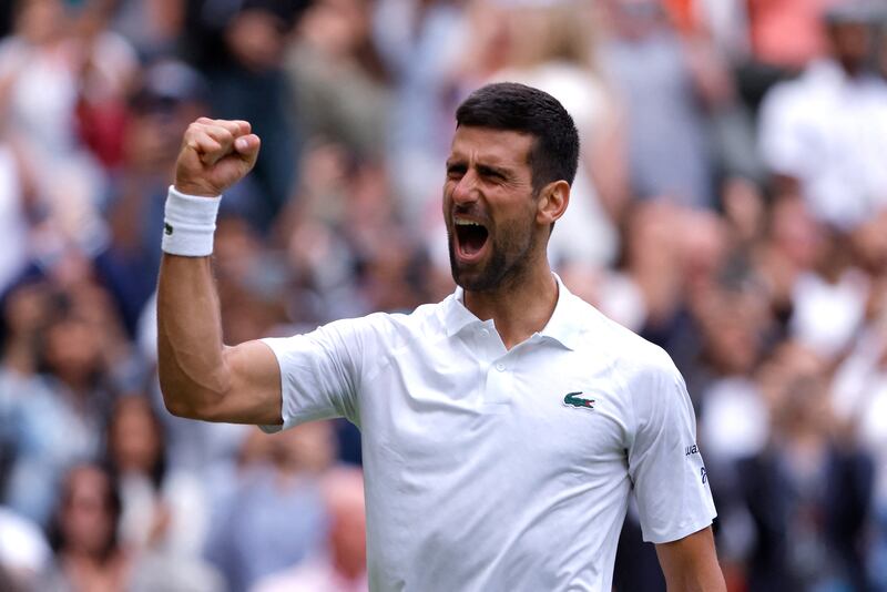 Serbia's Novak Djokovic celebrates after winning his quarter-final match against Russia's Andrey Rublev at Wimbledon on July 11, 2023. Reuters