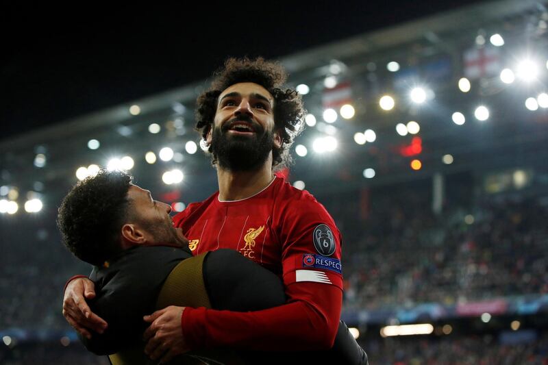 Liverpool's Mohamed Salah celebrates scoring their second goal with Alex Oxlade-Chamberlain Action. Reuters