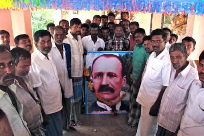 Villagers in Pallar Patti with a portrait of John Pennycuick. 

Credit: Eric Randolph/The National                              