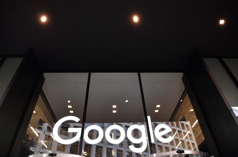 (FILES) In this file photo taken on January 18, 2019 a logo is pictured above the entrance to the offices of Google in London. Google parent Alphabet reported a rare drop in revenue and profit on July 30, 2020, in a quarterly update that nonetheless topped market expectations. / AFP / Ben STANSALL

