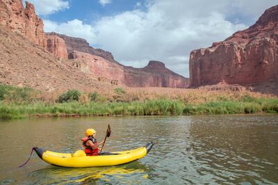 United States, Arizona, Grand Canyon National Park, girl kayaking on Colorado River.  MR, PR