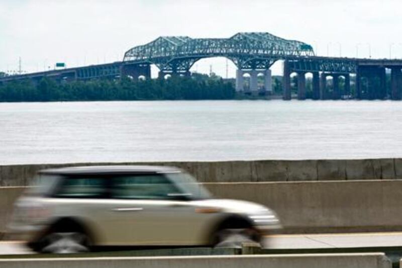 The Champlain Bridge crossing the St Lawrence River is seen on August 3, 2011 in Montreal. Nearly one-third of Montreal's deteriorating road structures need repair work and a dozen of them are considered in critical condition. That's according to a study that examined 555 pieces of infrastructure under local jurisdiction. (AP Photo/Paul Chiasson, The Canadian Press)