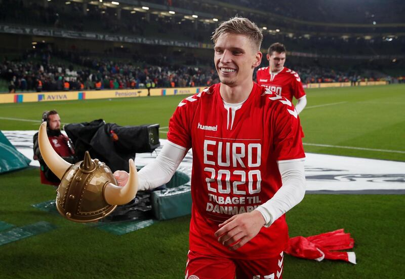 Denmark's Jens Stryger Larsen celebrates after the match. Reuters