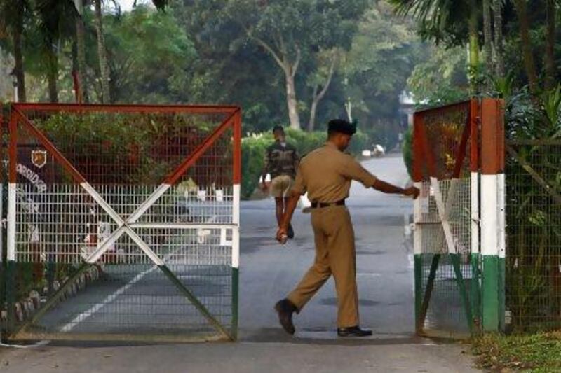 An Indian security official opens the gate to Indian-ruled Rangpur, some 350 kilometres north of Dhaka.