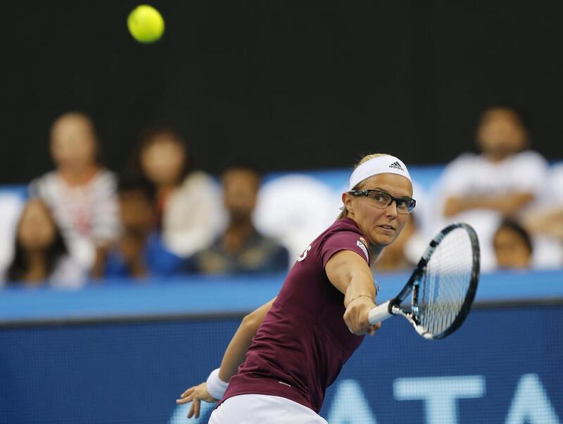 Manila Mavericks' Kirsten Flipkens of Belgium hits a return to Singapore Slammers' Daniela Hantuchova of Slovakia during their singles match at the IPTL on Saturday in Dubai. Ahmed Jadallah / Reuters