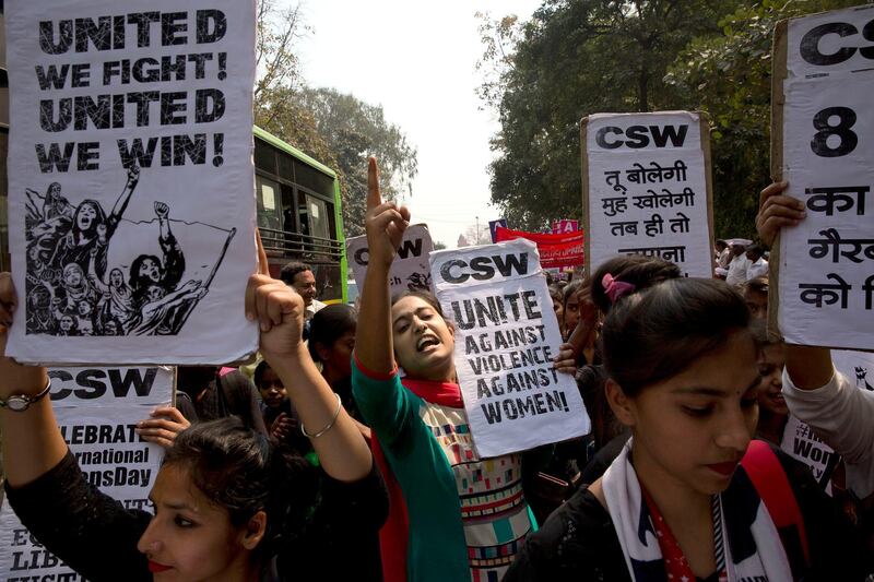 Indian women shout slogans during a march to observe International Women's Day in New Delhi, India, Thursday, March 8, 2018. Hundreds of women held street plays and march in the Indian capital highlighting domestic violence, sexual attacks and discrimination in jobs and wages against them. Violent crime against women has been on the rise in India despite tough laws enacted by the government. (AP Photo/Manish Swarup)