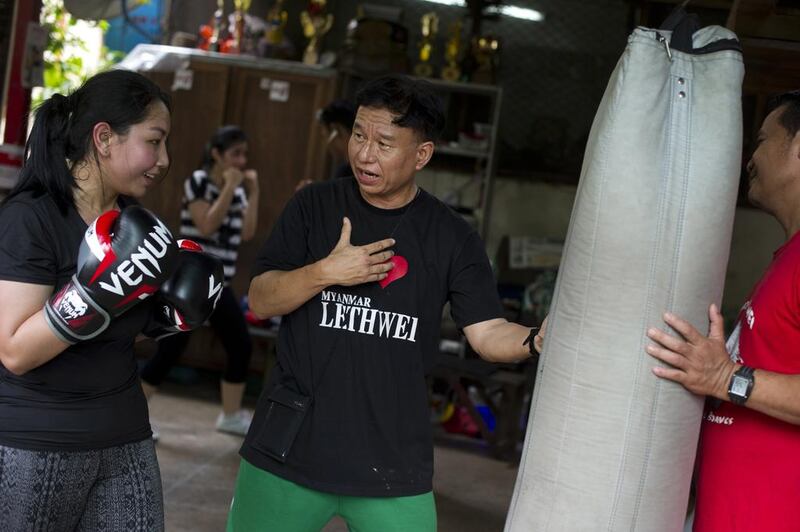 Medical sciences student Moe Pwint Oo, left, trains in Lethwei at a gym in Yangon. Ye Aung Thu / AFP 