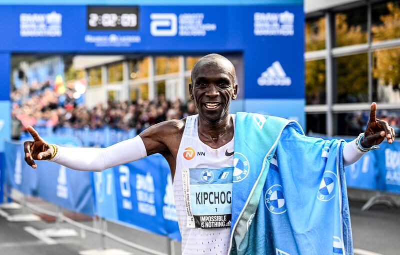 Eliud Kipchoge celebrates after winning the Berlin Marathon with a new world record time. EPA