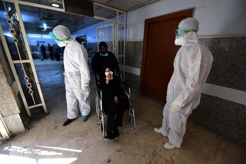 epa08272149 Members of the medical team spray disinfectant as a precaution against the novel coronavirus outbreak at the Al-Kindi hospital in Baghdad, Iraq, 05 March 2020. Iraqi Health Ministry confirmed on 04 March 2020 a second death resulted from coronavirus of a 65-year-old man in Baghdad, it added that the total cases of coronavirus are 32 in the country. The Iraqi authorities expanded the suspension of entry of foreign arrivals directly or indirectly until further notice, in addition to suspending schools and universities for two weeks, to prevent coronavirus.  EPA/MURTAJA LATEEF