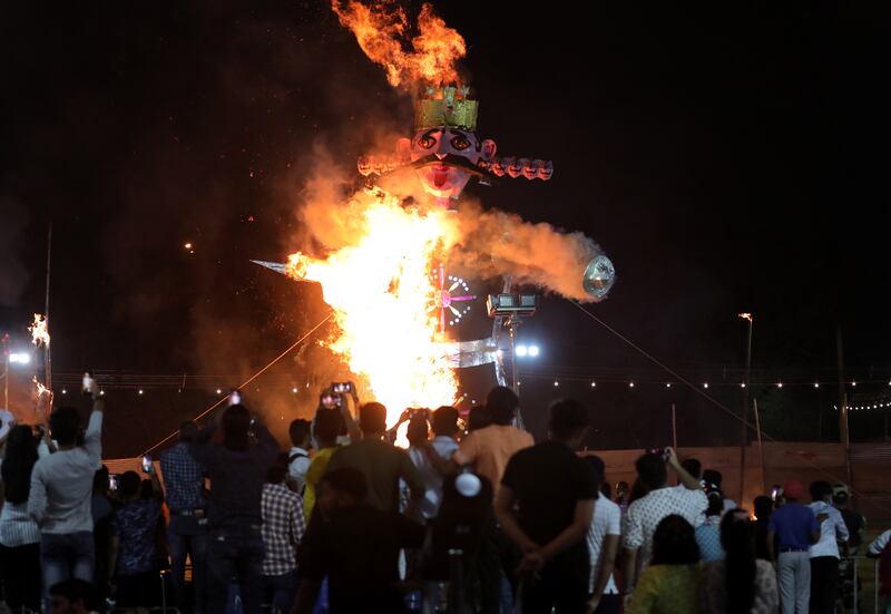 An effigy of demon king Ravana burns during the Dussehra festival celebrations in New Delhi, India. EPA