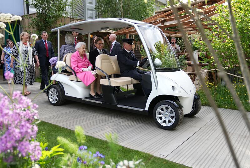 Britain's Queen Elizabeth II begins her tour of the annual Chelsea Flower Show in west London in an electric buggy. PA