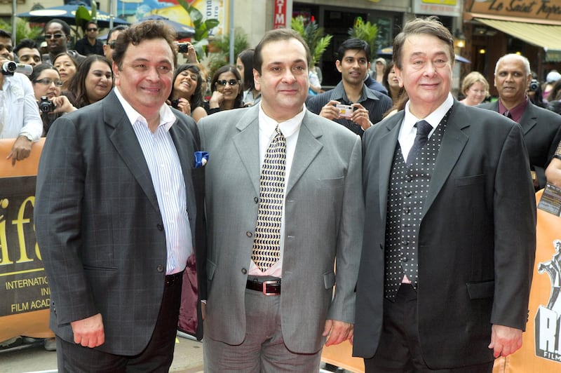 Rishi Kapoor (L), Rajiv Kapoor and Randhir Kapoor (R) pose for a photo outside the TIFF Bell Lightbox Theatre in Toronto June 26, 2011.  Considered the first family of Indian Cinema, the Kapoors were attending a tribute to the career of their late father director Raj Kapoor.   REUTERS/Fred Thornhill  (CANADA - Tags: ENTERTAINMENT)