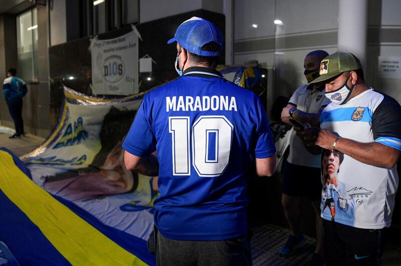 Supporters of Diego Maradona gather outside the hospital where he undergoes a brain surgery for a blood clot, in Olivos, Buenos Aires. AFP