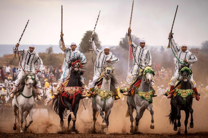 Moroccan horsemen perform traditional horse riding during a Moussem culture and heritage festival in the capital, Rabat. All photos by AFP