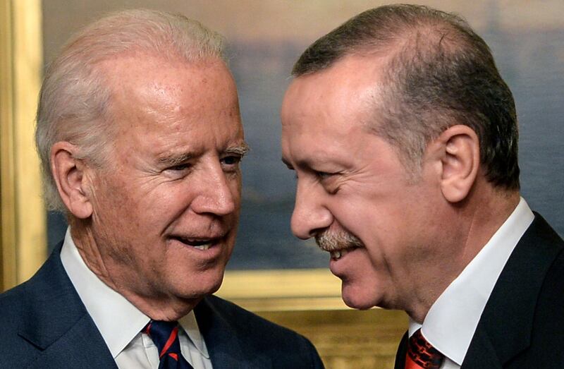 (FILES) In this file photo taken on November 22, 2014, US Vice President Joe Biden (L) speaks with Turkish President Recep Tayyip Erdogan at Beylerbeyi Palace in Istanbul.  President Biden has opened his presidency by taking a visibly harder line on Turkey, with analysts expecting a rocky path ahead between the uneasy allies as their interests increasingly diverge. Erdogan, like many of the leaders who wooed Biden's predecessor Donald Trump, is getting an early cold shoulder from Biden, who before being elected described the Islamist-aligned populist an autocrat and promised to empower the opposition. / AFP / Bulent KILIC

