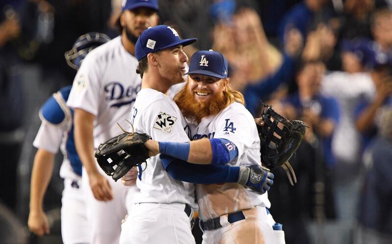Oct 31, 2017; Los Angeles, CA, USA; Los Angeles Dodgers third baseman Justin Turner (10) and shortstop Corey Seager (5) celebrate after the Los Angeles Dodgers defeated the Houston Astros in game six of the 2017 World Series at Dodger Stadium. Mandatory Credit: Robert Hanashiro-USA TODAY Sports