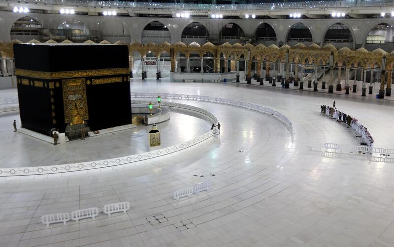 Worshippers perform taraweeh prayer in front of the Kaaba in the Grand Mosque on the first day of Ramadan in Makkah, Saudi Arabia. While the general public are not allowed to enter because of the coronavirus pandemic, imams at Islam’s holiest site still lead the daily prayers with staff and workers. AFP