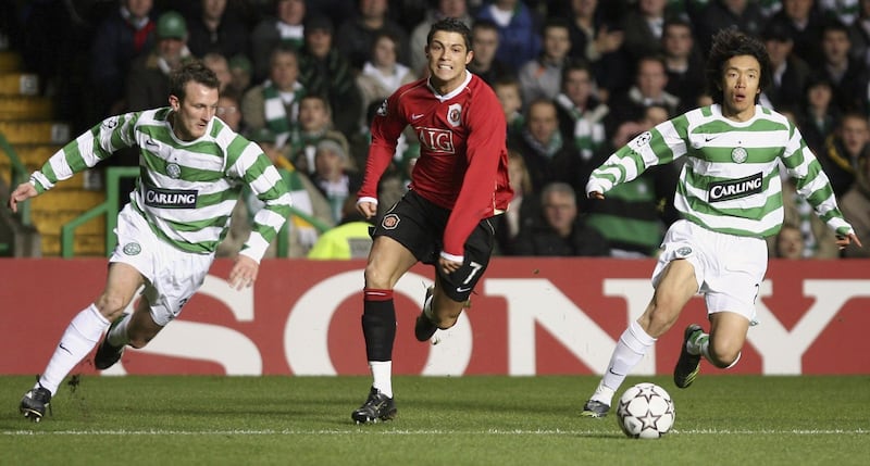 GLASGOW, UNITED KINGDOM - NOVEMBER 21:  Lee Naylor (L) and Shunsuke Nakamaura of Celtic track Cristiano Ronaldo of Manchester United during the UEFA Champions League Group F match between Celtic and Manchester United at Celtic Park November 21, 2006 in Glasgow, Scotland.  (Photo by Jeff J Mitchell/Getty Images)