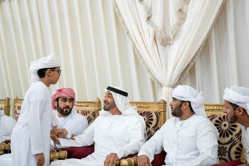 SHAWAMEKH, ABU DHABI, UNITED ARAB EMIRATES - September 15, 2019: HH Sheikh Mohamed bin Zayed Al Nahyan, Crown Prince of Abu Dhabi and Deputy Supreme Commander of the UAE Armed Forces (3rd R), offers condolences to the family of martyr Warrant Officer Zayed Musllam Suhail Al Amri.

( Mohamed Al Hammadi / Ministry of Presidential Affairs )
---