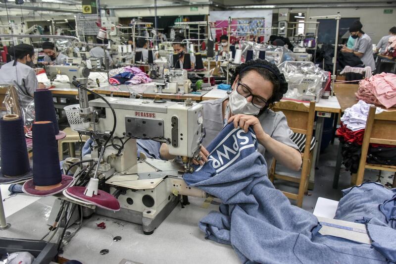Employees work at the Arequipe clothing factory in Bogota, Colombia, which had remained closed for 50 days during the government's coronavirus lockdown. Getty Images