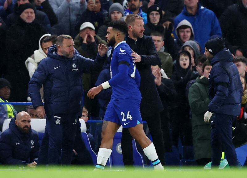 Soccer Football - Premier League - Chelsea v AFC Bournemouth - Stamford Bridge, London, Britain - December 27, 2022 Chelsea's Reece James with manager Graham Potter after being substituted due to injury REUTERS/David Klein EDITORIAL USE ONLY.  No use with unauthorized audio, video, data, fixture lists, club/league logos or 'live' services.  Online in-match use limited to 75 images, no video emulation.  No use in betting, games or single club /league/player publications.   Please contact your account representative for further details. 