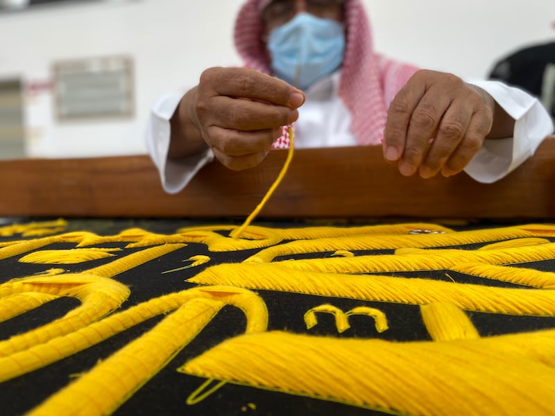 The belt of the kiswah being embroidered.
