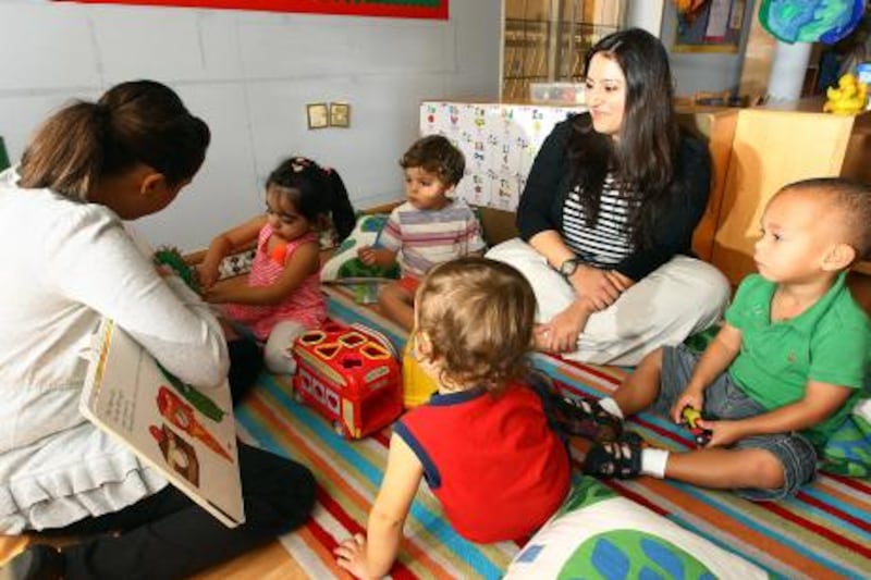 Dubai, United Arab Emirates- August 01, 2011:  Asma Maladwala, Director, Inspire Children's Nursery (R) seen with kids during the Story Time class  in Dubai .  ( Satish Kumar / The National ) For Arts & Life