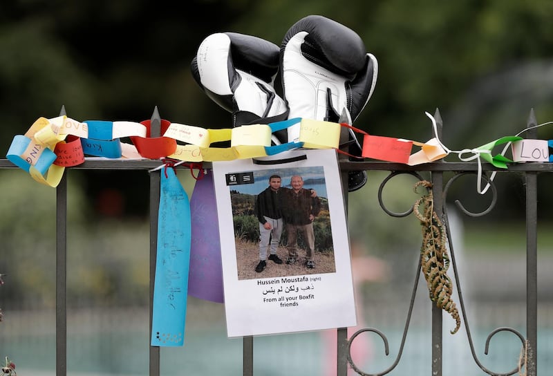 A tribute for mosque shooting victim Hossein Moustafa hangs on a wall at the Botanical Gardens in Christchurch, New Zealand, Thursday, March 21, 2019. Thousands of people were expected to come together for an emotional Friday prayer service led by the imam of one of the two New Zealand mosques where 50 worshippers were killed in a white supremacist attack on Friday March 15. (AP Photo/Mark Baker)