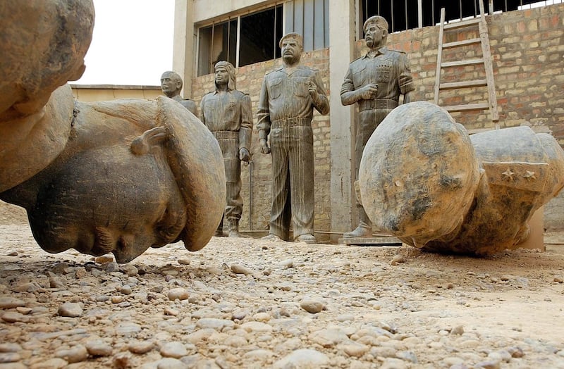 Statues of topped dictator Saddam Hussein in a factory, in Baghdad, Iraq, in 2003. EPA