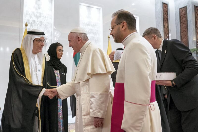 ABU DHABI, UNITED ARAB EMIRATES - February 03, 2019: Day one of the UAE papal visit - HE Zaki Anwar Nusseibeh, UAE Minister of State (L) greets His Holiness Pope Francis, Head of the Catholic Church (2nd R) during his arrival at the Presidential Airport. 


( Mohamed Al Hammadi / Ministry of Presidential Affairs )
---