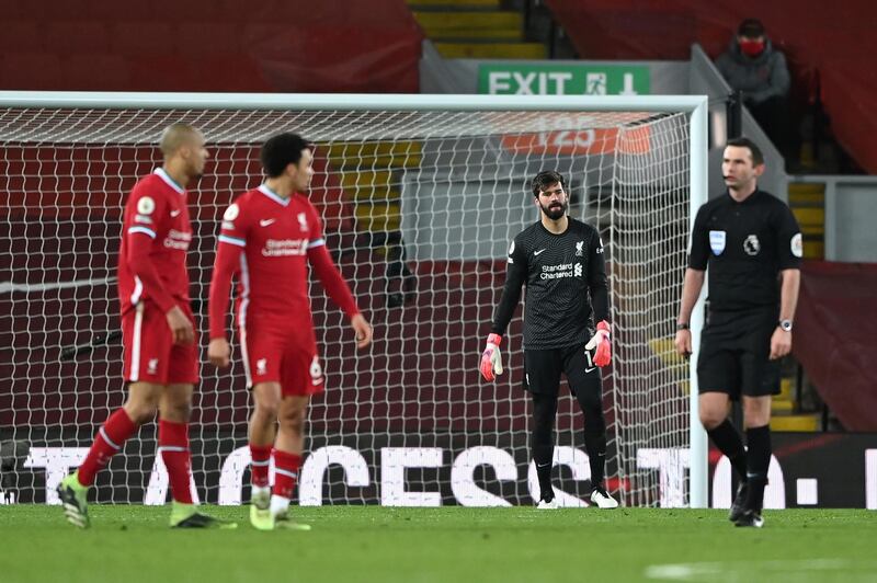 LIVERPOOL, ENGLAND - FEBRUARY 07: Alisson Becker of Liverpool looks dejected after Liverpool's third goal scored by Raheem Sterling (Not pictured) of Manchester City during the Premier League match between Liverpool and Manchester City at Anfield on February 07, 2021 in Liverpool, England. Sporting stadiums around the UK remain under strict restrictions due to the Coronavirus Pandemic as Government social distancing laws prohibit fans inside venues resulting in games being played behind closed doors. (Photo by Laurence Griffiths/Getty Images)