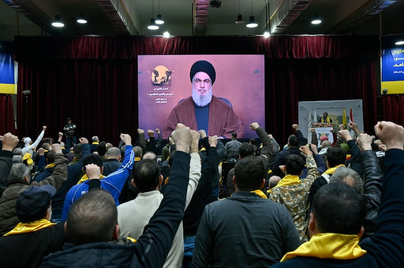 Supporters of Hezbollah listen to a speech by leader Hassan Nasrallah in Beirut on Tuesday. EPA