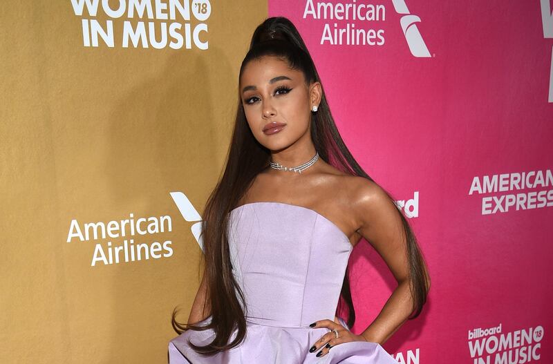 FILE - In a Thursday, Dec. 6, 2018 file photo, Ariana Grande attends the 13th annual Billboard Women in Music event at Pier 36, in New York.  Chinese tech giant Tencent is in talks with French media company Vivendi to buy 10% of Universal Music Group, whose artists include Ariana Grande, according to an announcement from Vivendi Tuesday Aug. 6, 2019.(Photo by Evan Agostini/Invision/AP, File)