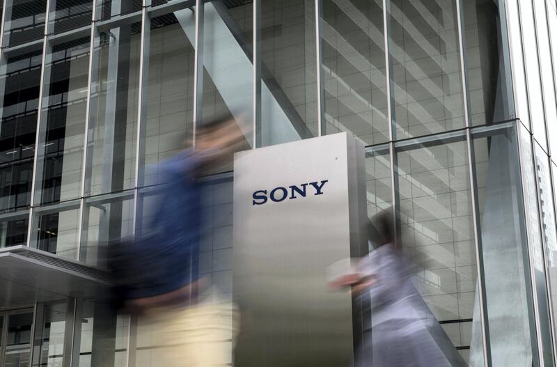 Pedestrians walk past the Sony Corp. headquarters in Tokyo, Japan, on Friday, April 27, 2018. Sony forecast weaker sales and operating profits across most of its business units for the coming year, setting a lower hurdle for a new leader seeking to recapture some of the electronics maker’s faded glory. Photographer: Tomohiro Ohsumi/Bloomberg