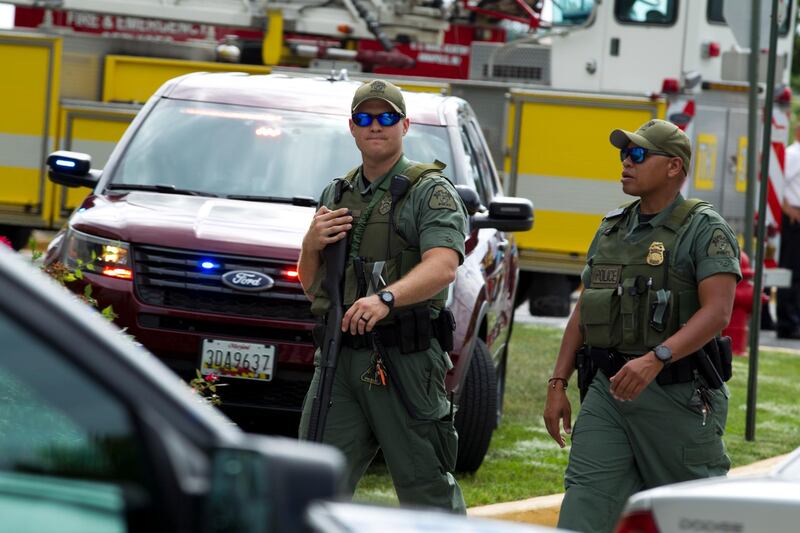 Maryland police officers patrol the area after the shooting at The Capital Gazette newspaper in Annapolis. Jose Luis Magana / AP Photo