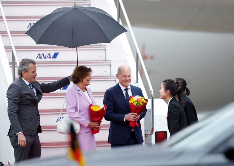 German Chancellor Olaf Scholz and his wife Britta Ernst arrive in Hiroshima. Reuters