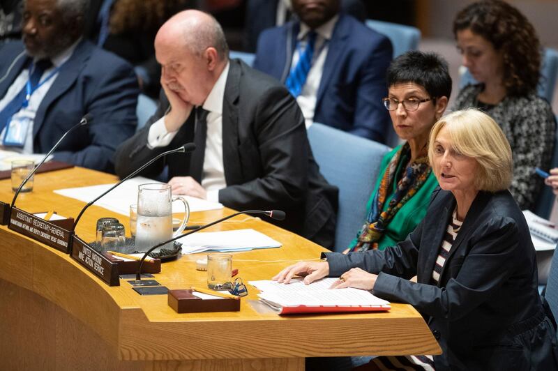 Turkish Ambassador to the United Nations Feridun Sinirlioglu, left, and United Nations Assistant Secretary-General for Humanitarian Affairs Ursula Mueller, center, listen as Agnes Marcaillou, Director of the United Nations Mine Action Service, Department of Peace Operations speaks during a Security Council meeting on the situation in Syria, Thursday, Oct. 24, 2019 at United Nations headquarters. (AP Photo/Mary Altaffer)