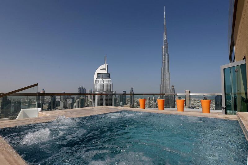 The penthouse swimming pool at Damac’s new Damac Maison tower comes with an outsanding view of the Dubai landscape. Satish Kumar / The National