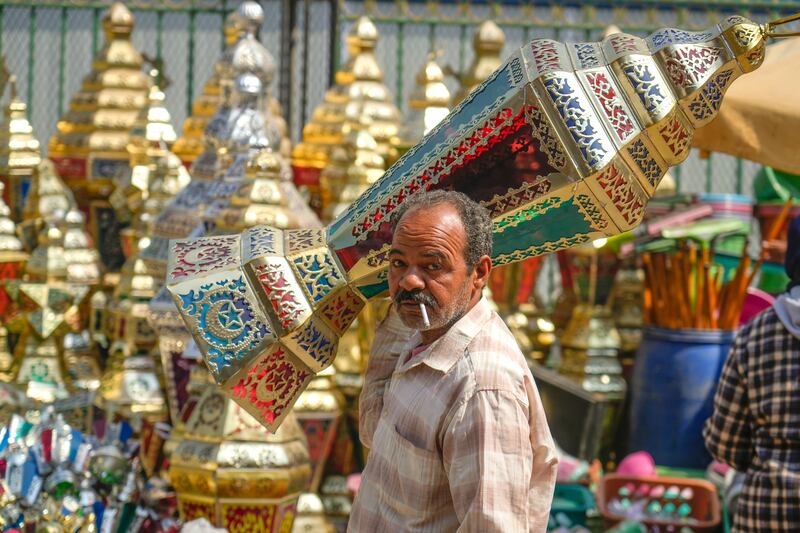 A man carries a traditional lantern at Sayyeda Zeinab Ramadan market in Cairo, before the start of the holy month. AFP