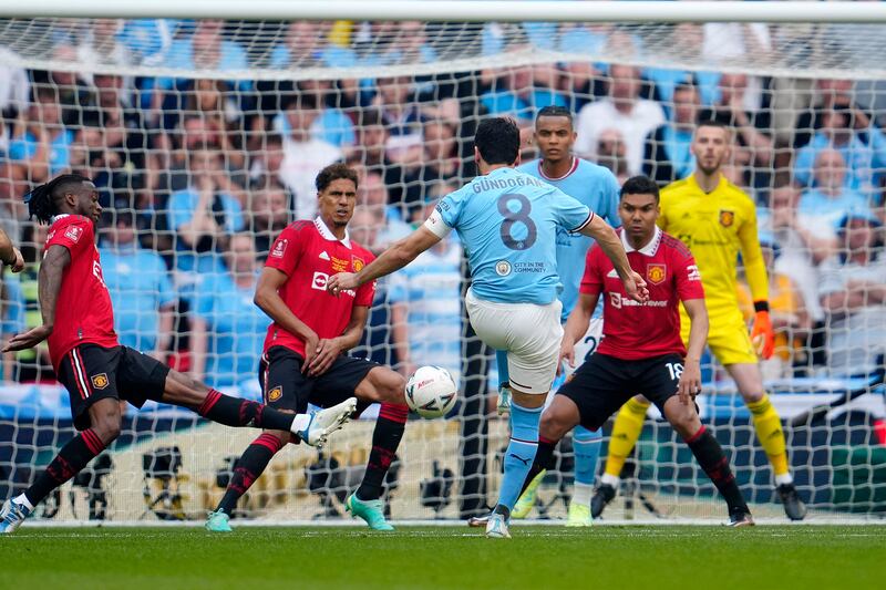 Manchester City's Ilkay Gundogan shoots to scores his team's second goal. AP