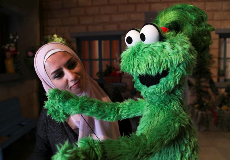 Puppeteer Leen Sorsok with Ameera, the new muppet character in 'Ahlan Simsim'.