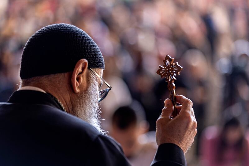 A Coptic priest leads mass as Orthodox Christians observe Good Friday prayers at the Saint Simon Monastery near Cairo. Egypt’s Grand Mufti has approved a death sentence for the murderer of a Coptic priest in April. AFP