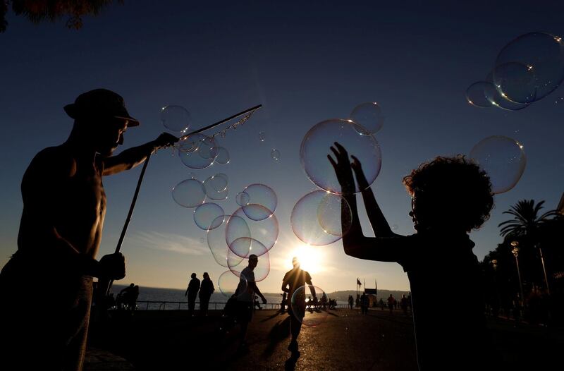 A street artist performs during a warm and sunny autumn day on the Promenade des Anglais in Nice, France. Reuters