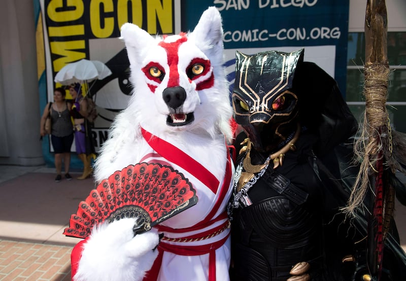 Christiana Broughton, left, and her mom Carolyn, both of Jacksonville, Fla., cosplay as Amaterasu from the video game Okami and a 70's-era Black Panther, at Comic-Con International. Kevin Sullivan / The Orange County Register via AP