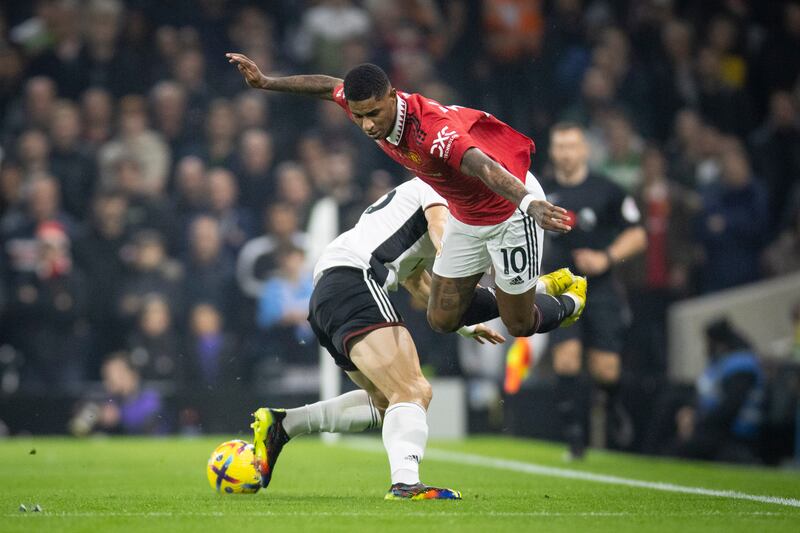 United's Marcus Rashford is sent flying by Joao Palhinha of Fulham. EPA