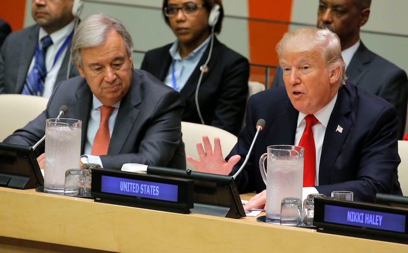 U.N. Secretary General Antonio Guterres (L) watches as U.S. President Donald Trump speaks during a session on reforming the United Nations at U.N. Headquarters in New York, U.S., September 18, 2017. REUTERS/Lucas Jackson