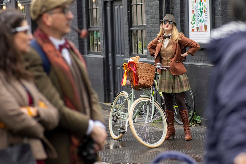 Riders gather in the rain for the Tweed Run, an event organised by Bourne & Hollingsworth, a self-described 'creative lifestyle company'. PA