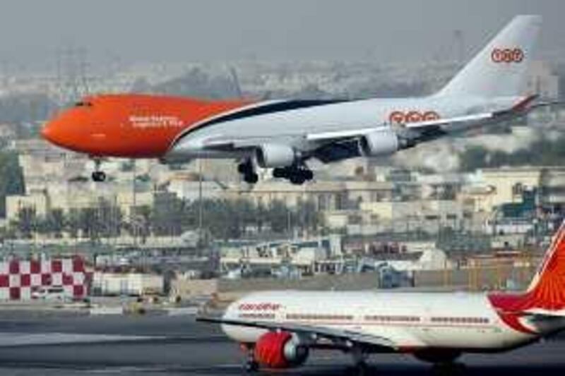 Dubai - July 29th  ,  2008 - Stock Picture of a TNT cargo plane landing  at Dubai International Airport ( Andrew Parsons  /  The National ) *** Local Caption ***  ap0011-2907-dubai airport stock.jpgap0011-2907-dubai airport stock.jpg