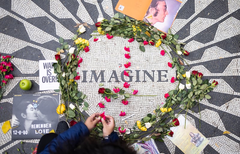 John Lennon fans gather to mark the anniversary of his death in New York. EPA