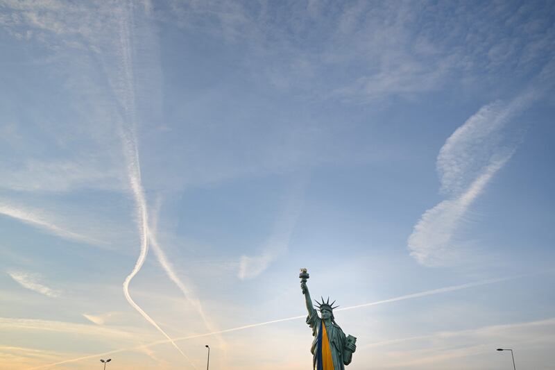 A replica of the Statue of Liberty in Colmar, eastern France, covered in the national colours of Ukraine. AFP